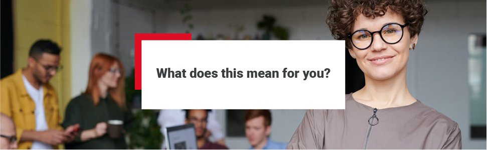 A female real estate professional standing in an office. There are colleagues / other real estate professionals in the background working and having discussions. The text ‘what does this mean for you’ has been positioned over the image.